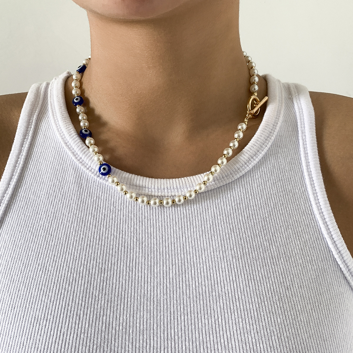 European and American cross-border jewelry: Geometric simple OT buckle single-layer collarbone chain, retro patchwork imitation pearl eye necklace details Picture