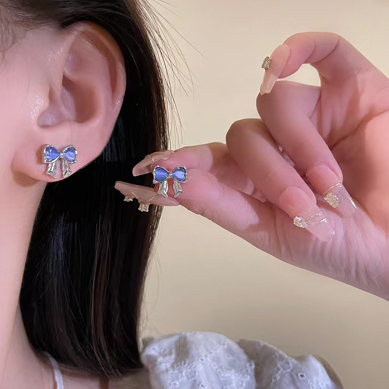 Mini, fresh and cute blue cat's eye stone bow stud earrings for women 2025 new bestsellers, fashionable and versatile earrings full figure