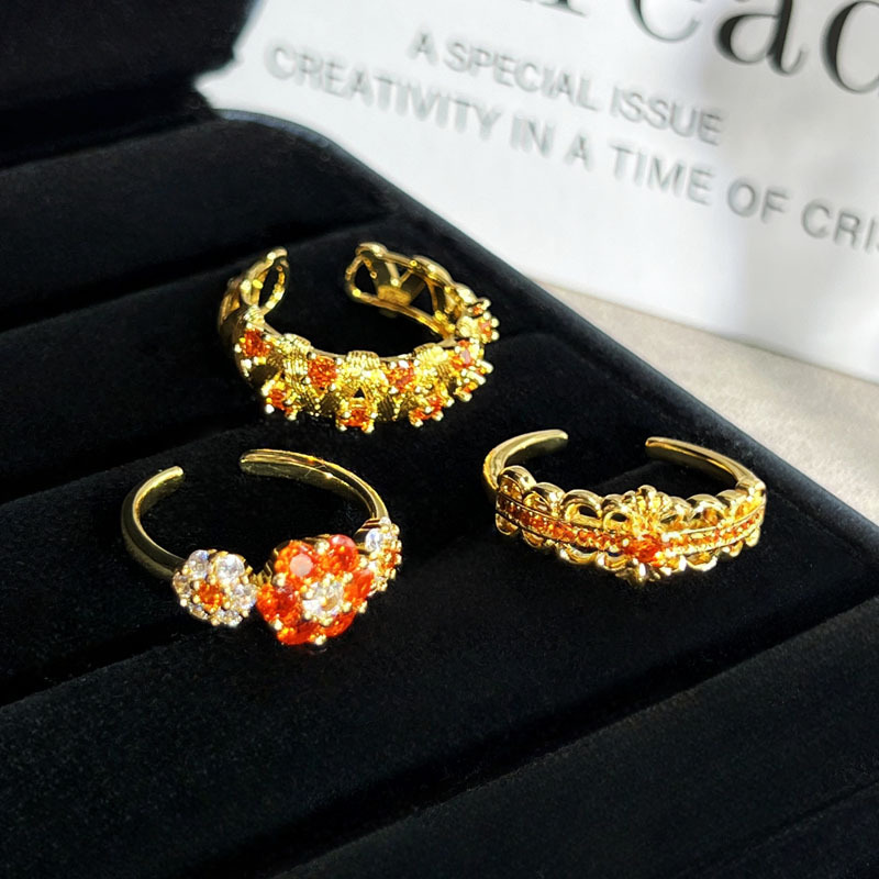A simple open ring set with orange-red zircon in a mid-style style, featuring a retro brushed flower and a hollowed-out design, exuding a unique and elegant charm Specification drawing