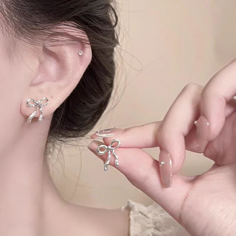 Minimalist silver bow stud earrings, a new bestseller in 2025, exudes a unique and elegant feminine charm full figure