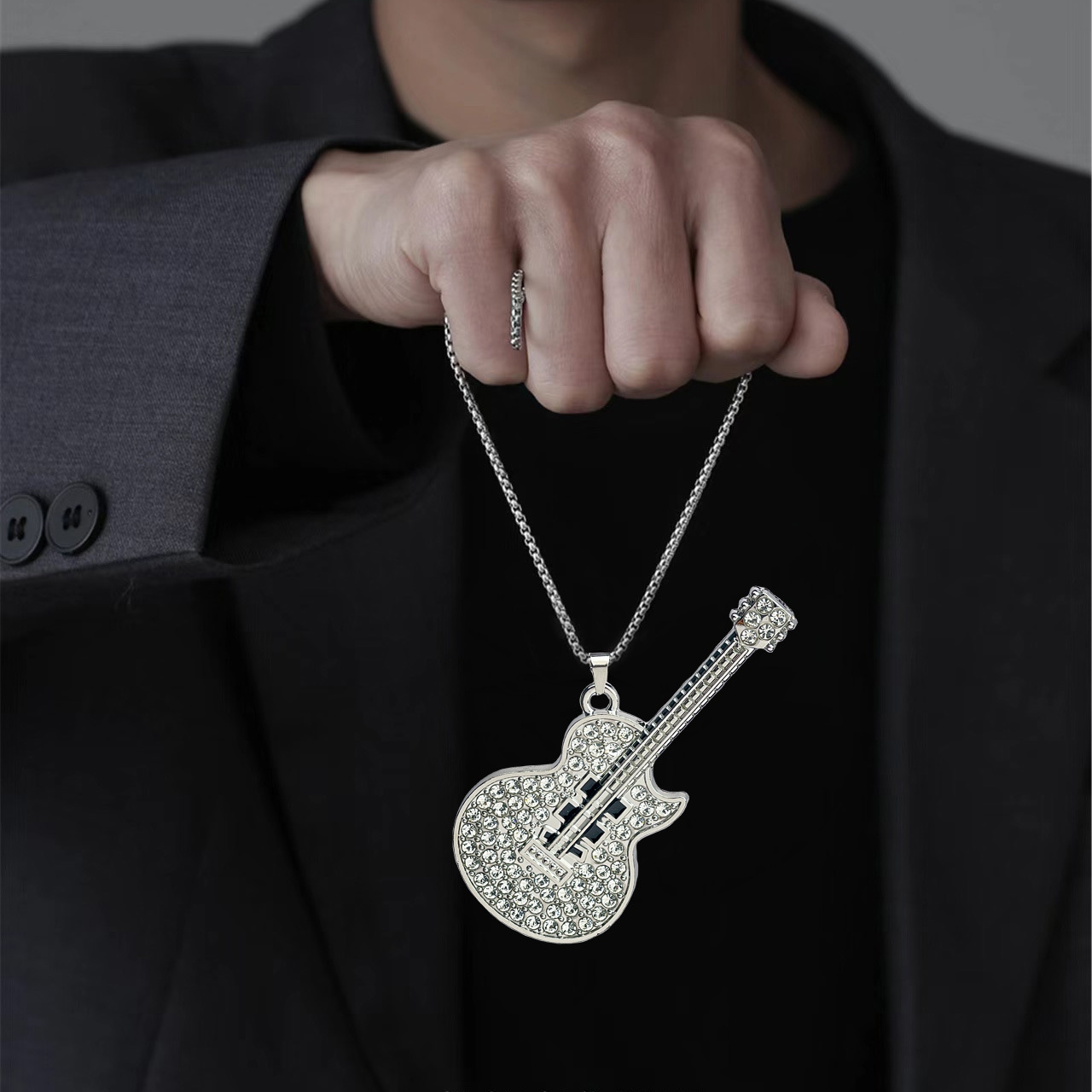 Wholesale of new European and American style personalized music guitar pendants, fashionable and niche full-diamond titanium steel necklaces for men and women full figure