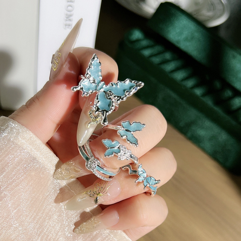 The new silver-white-blue gilded enamel liquid butterfly opening ring for women features a simple and niche design with a light luxury feel details Picture
