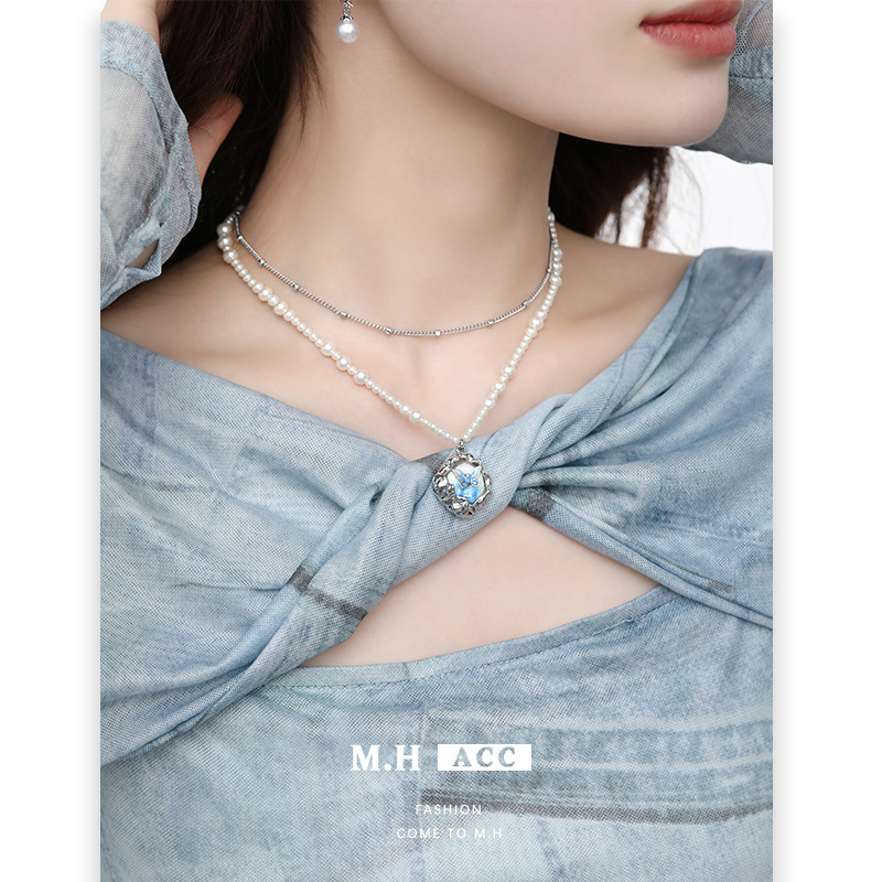 High-end pearl necklace, niche design, blue and green gradient butterfly sweater chain, women's light luxury style, autumn and winter resin pendant details Picture