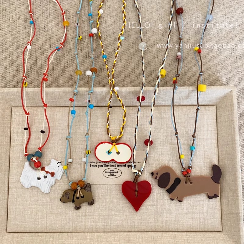 Cute and adorable apple heart-shaped puppy pendant necklace for women, colorful, fashionable and versatile long braided rope collarbone chain full figure