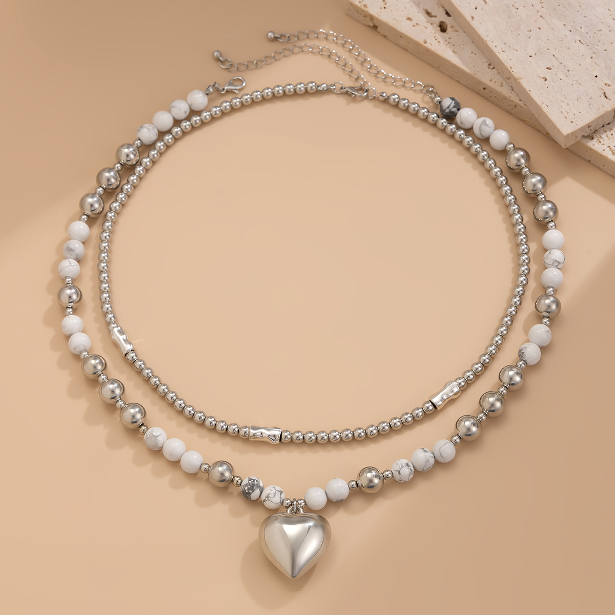 European and American cross-border jewelry, hollowed-out versatile bead collarbone chain, simple multi-layer heart-shaped alloy pendant necklace set Application Scenario