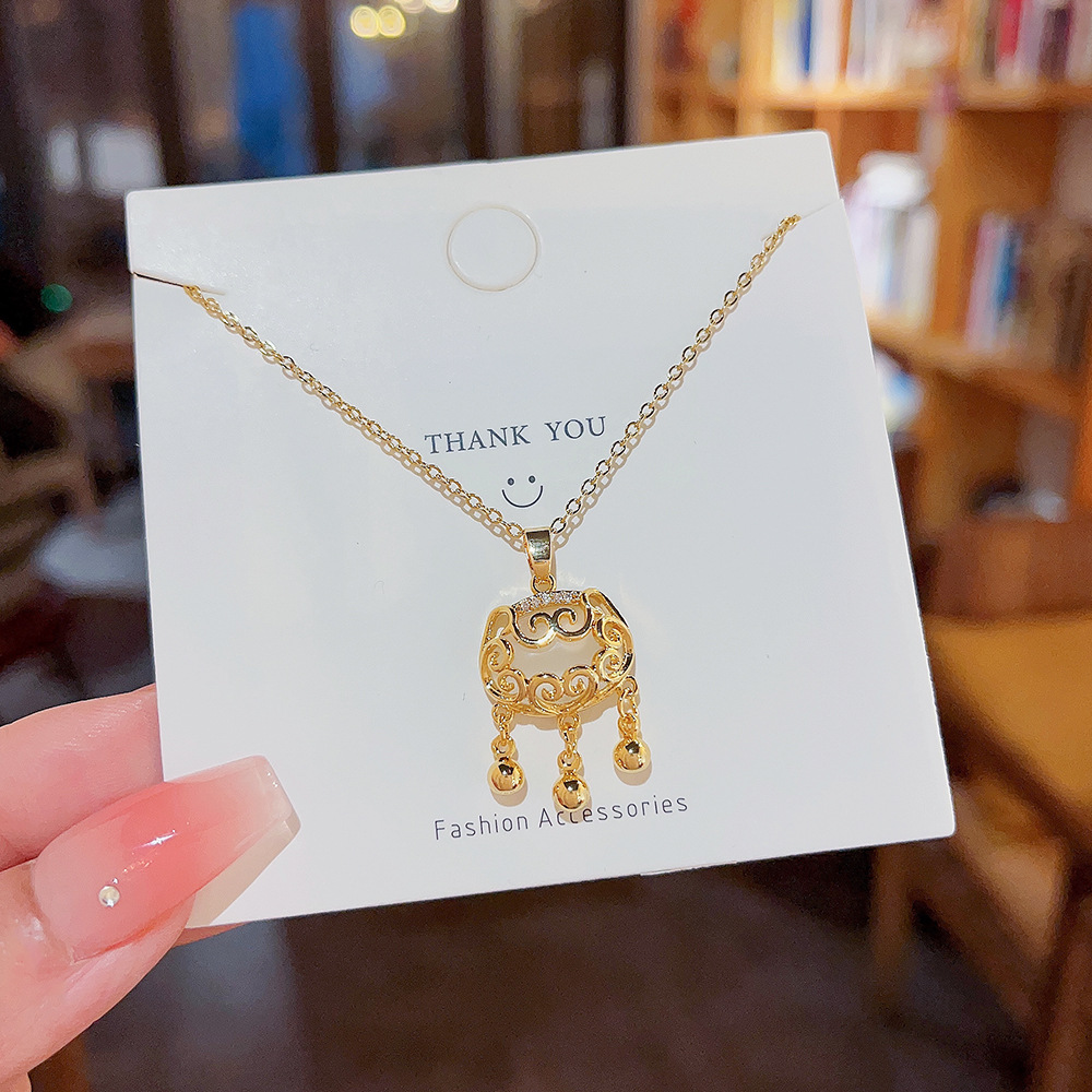 Xiangyun cat's eye stone Peace Lock National Trend style pendant, niche design, high-end feel, titanium steel necklace, women's collarbone chain wholesale details Picture