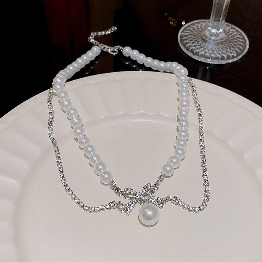 European and American light luxury pearl necklace, design sense, Internet celebrity bestseller, bow pendant, hair accessory, pearl chain, high-end collarbone chain full figure