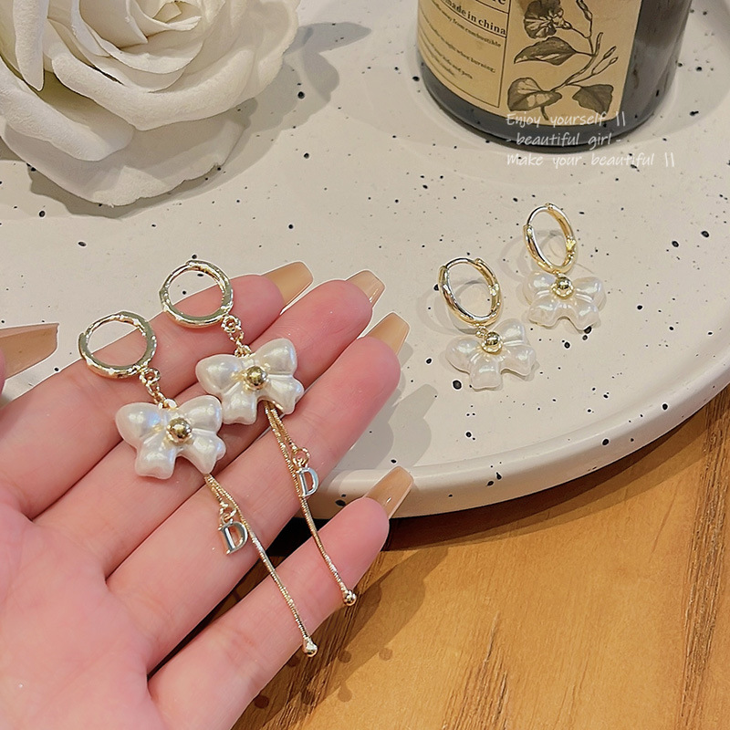 S925 Silver Needle, super ethereal, white bow stud earrings, women's high-end design, long tassel earrings wholesale full figure