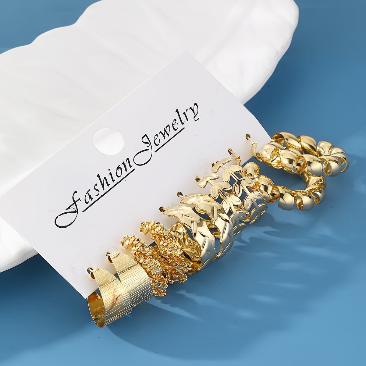 A 6-piece set of European and American fashionable commuting geometric hammered pattern earrings, creating a versatile golden stud imitation pearl women's earrings Application Scenario