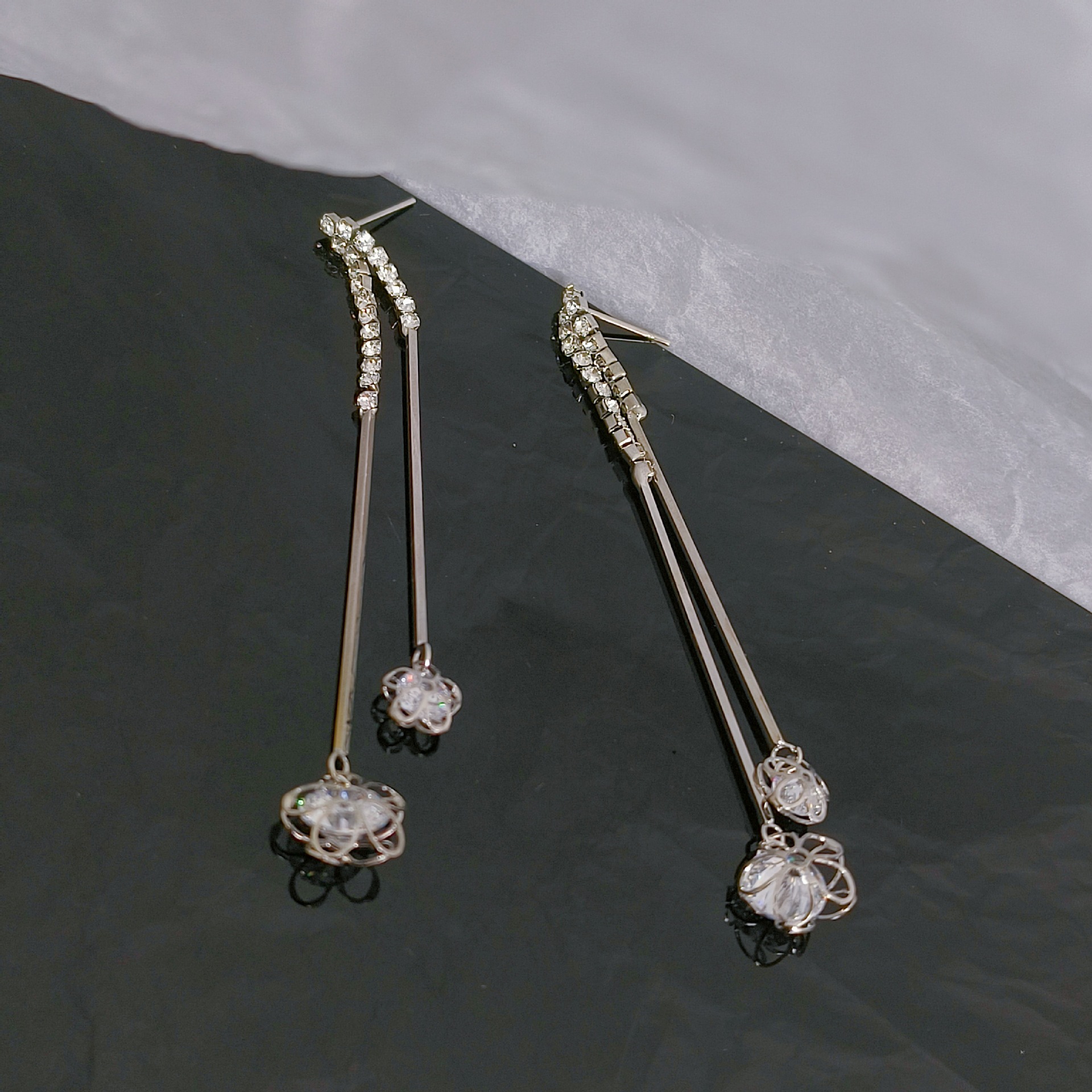 In 2025, a simple and long zircon tassel stud earring for women is a trendy European and American fashion accessory that goes well with a cold style details Picture