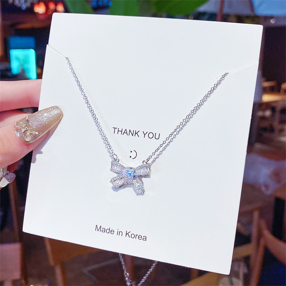 Wholesale of the 2025 new micro-inlaid zircon collarbone chain with a cold design sense, light luxury, niche and super sparkling butterfly necklace full figure