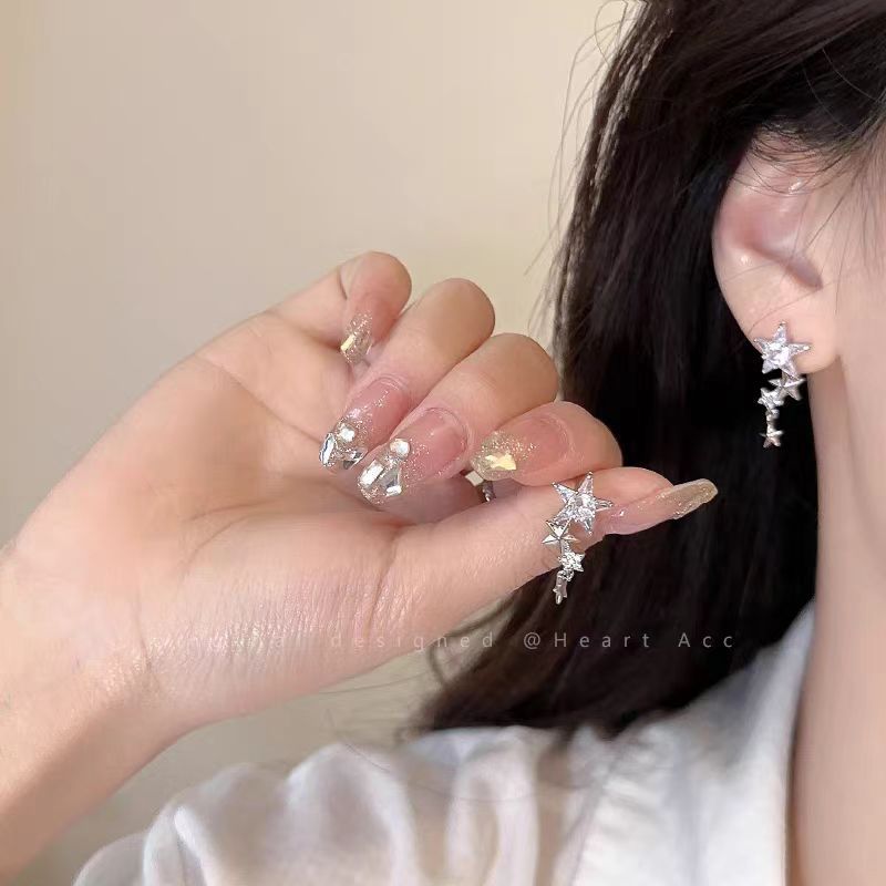 "Starlight Condenses into a River" exudes a sense of sophistication to the fullest! S925 Silver Needle diamond-encrusted five-pointed star earrings, long stud earrings details Picture