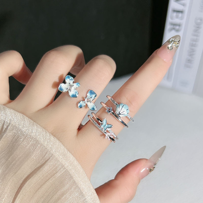 Blue butterfly flower language layered cream style gradient blue dynamic flower butterfly ring for women's fashionable cold style index finger ring full figure