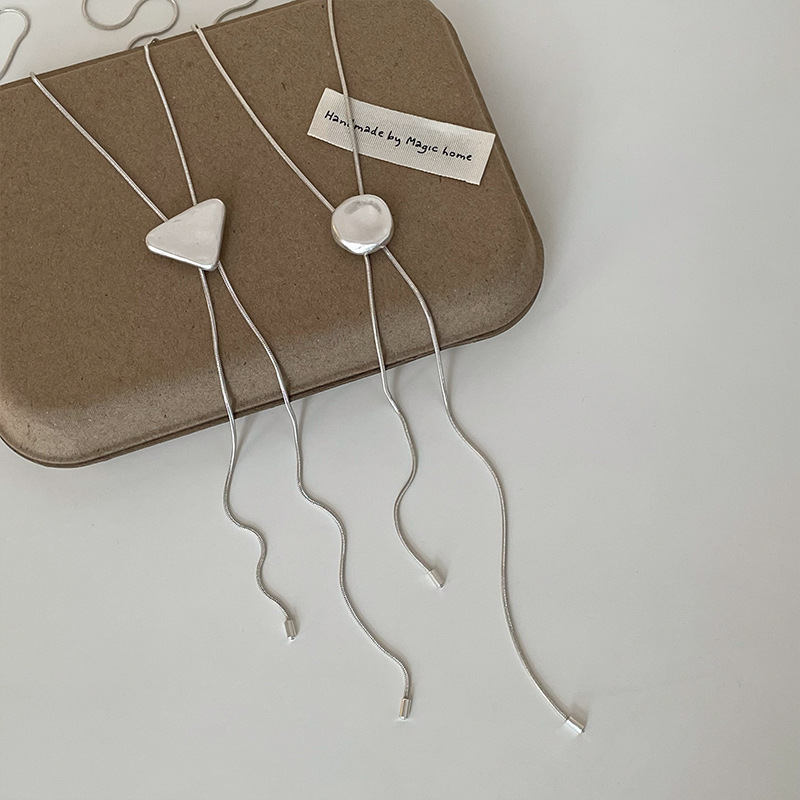 A simple and niche geometric round and triangular pull-out long necklace for women's ins style, a versatile necklace and sweater chain Application Scenario