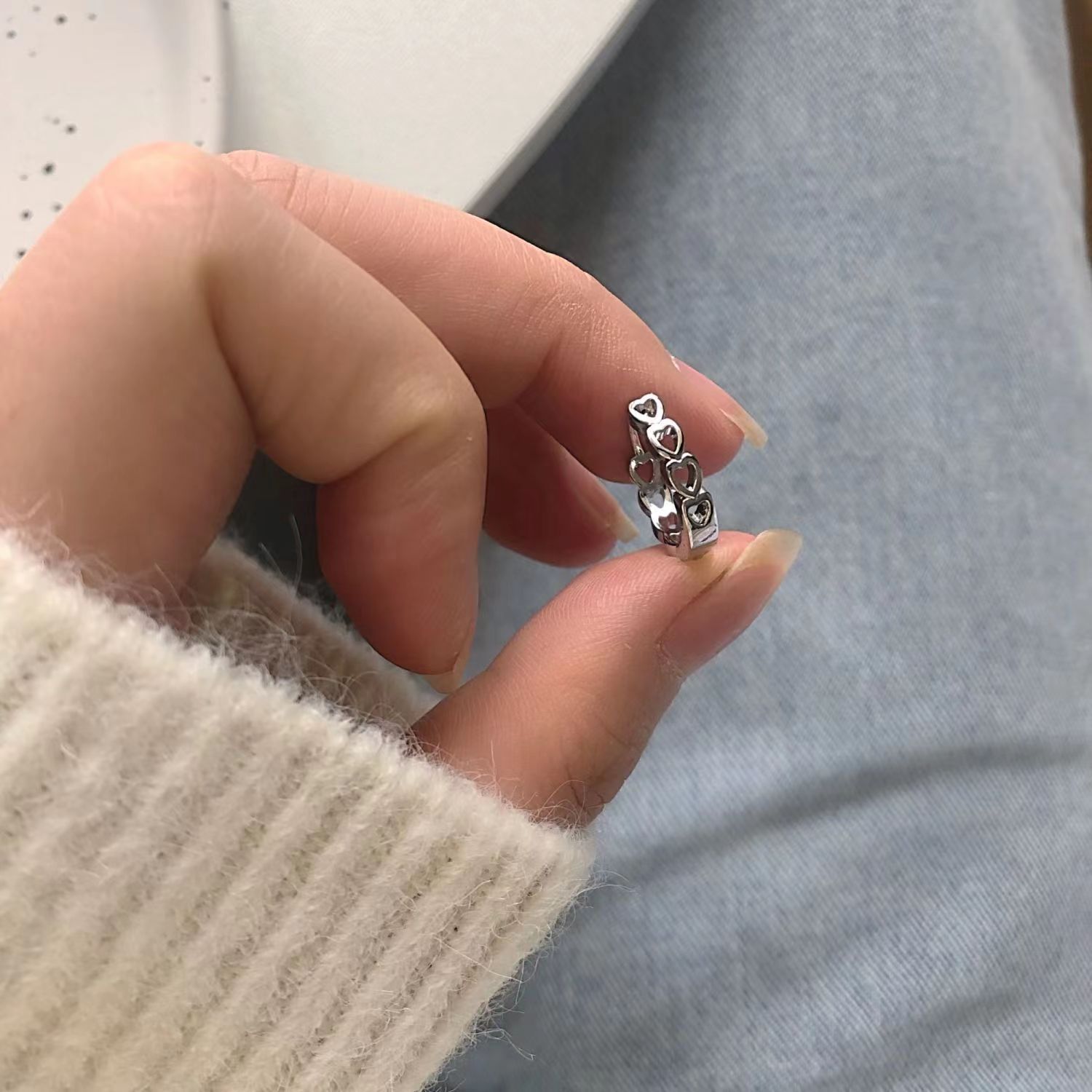 The simple and hollowed-out heart-shaped ear studs are fashionable and versatile for women, with a sweet and unique personality. The new style of ear studs in 2025 features a trendy and niche design details Picture