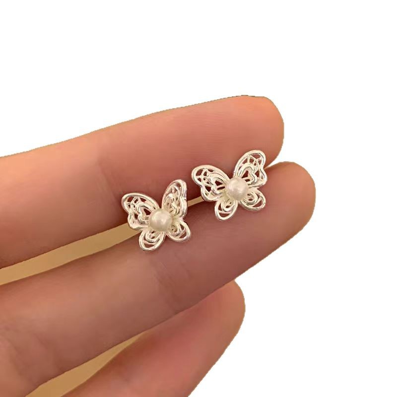 Korean-style hollowed-out butterfly pearl earrings on Instagram, a niche, sweet, exquisite and elegant style. New earrings for women with ear bone studs in 2025 Item Picture