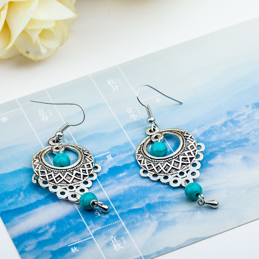Wholesale of European and American fashion retro ethnic style hollowed-out turquoise water drop earrings and Bohemian tassel stud accessories Application Scenario