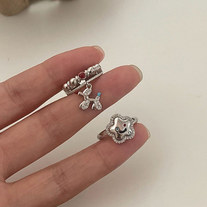 A niche cloud balloon dog open-mouth ring with a feminine personality and a high-end feel, featuring an INS style and a light luxury design. It's a cute food ring full figure