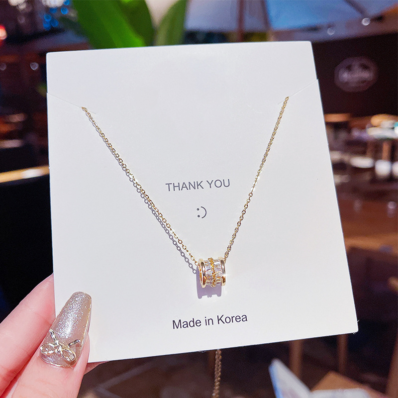 A light luxury and niche titanium steel necklace, a Korean fashion influencer's fresh collarbone chain, a trendy and simple zircon pendant full figure