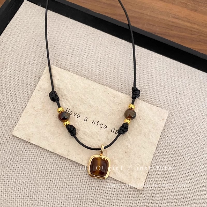 Tiger's eye stone woven leather rope necklace, a new 2024 women's light luxury and niche style sweater chain layering accessory Application Scenario