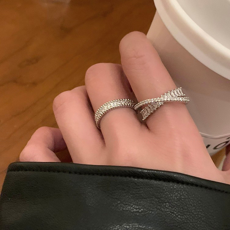 The interlaced zircon ring is a niche design for women, with a simple and adjustable opening. It is an exquisite and high-end plain ring details Picture
