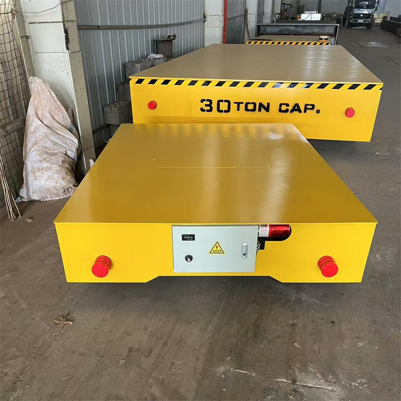 Electric flat car 3/5/10 ton factory direct supply warehouse track universal remote control trackless electric flat car Application Scenario