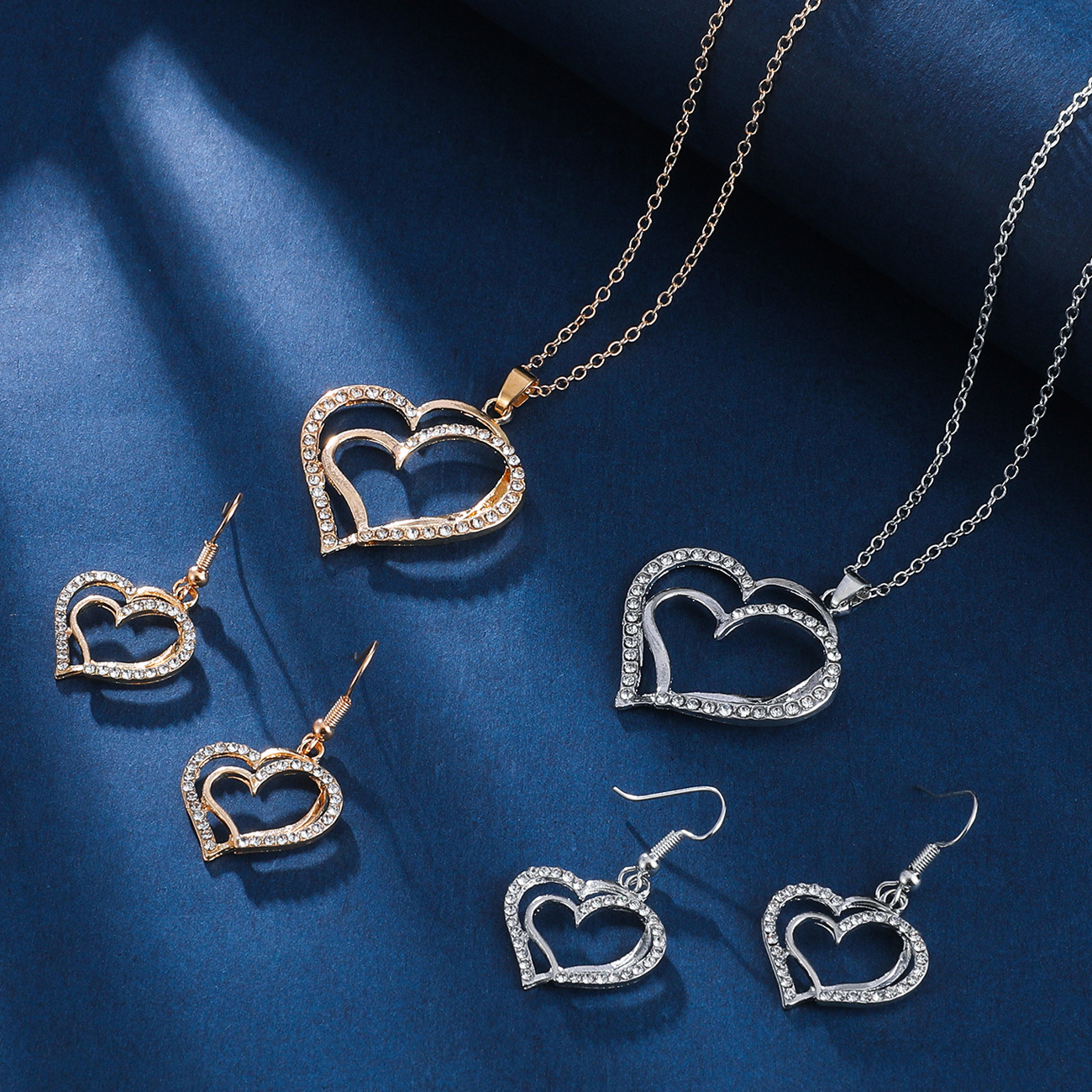 European and American women's heart-shaped jewelry set, retro, fashionable and individual alloy diamond-encrusted hollow heart-shaped pendant necklace earrings details Picture