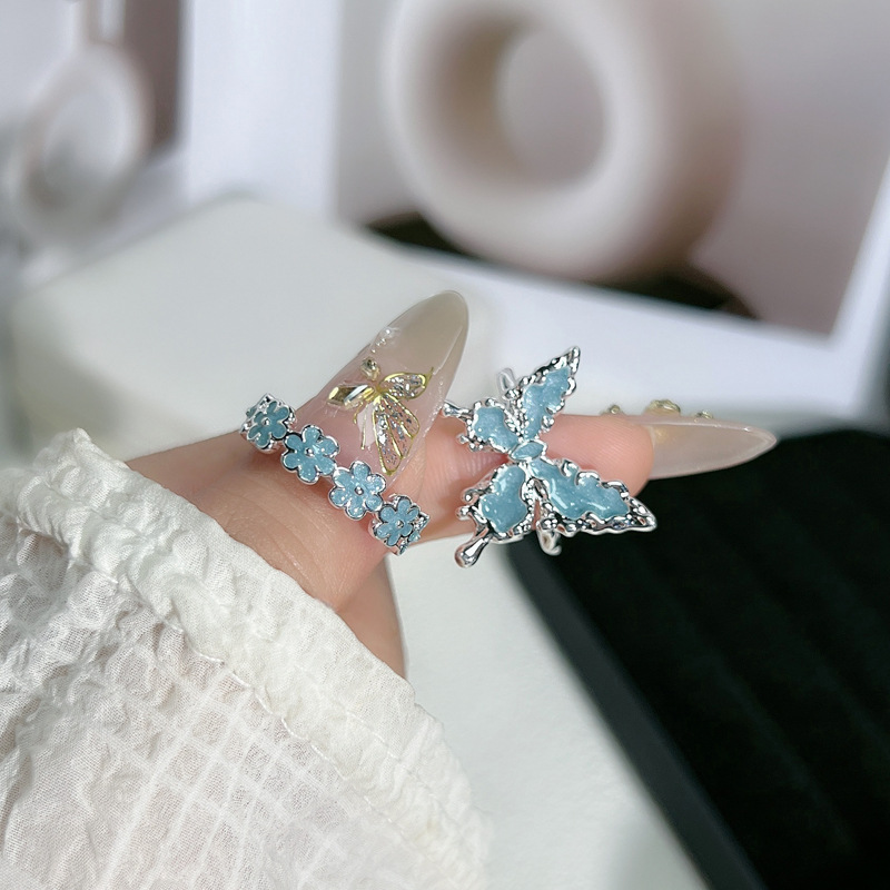 A new, fresh and simple layer-and-wear three-dimensional lava butterfly ring, a cold and elegant enamel index finger ring with a feminine flower texture details Picture