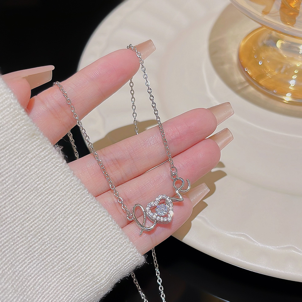 The love heart-shaped necklace is a versatile, light luxury, and niche design style collarbone chain. It's a new trendy neck chain and a stylish Korean accessory details Picture