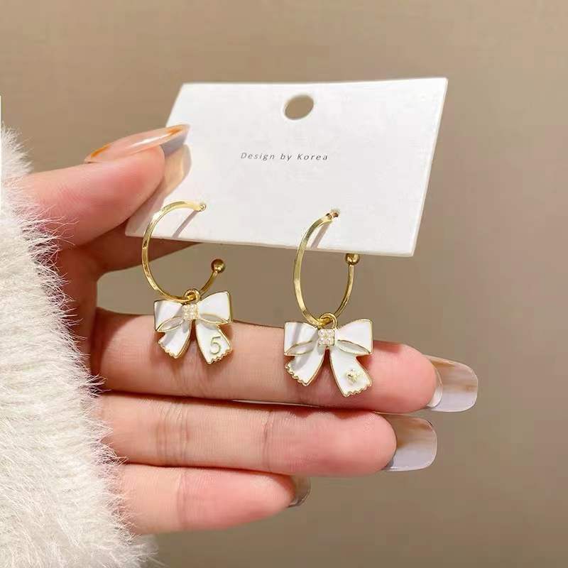 S925 Silver Needle Korean bow ear ring earrings, trendy and niche design, simple and elegant, goddess-like style stud earrings full figure