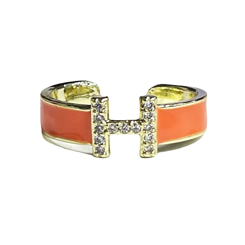 A Mambo style mint green enamel drop glaze H-letter open ring for women, a retro, light luxury, and court-style fashionable ring Item Picture