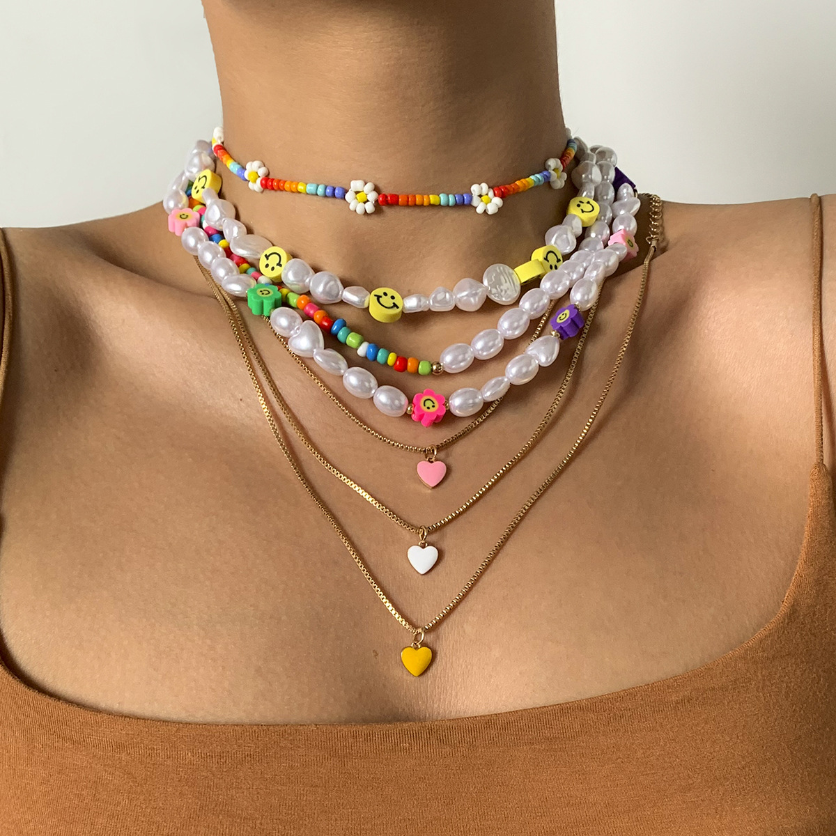 European and American cross-border jewelry: Pastoral rice bead woven Daisy necklace, simple oil-dripping heart-shaped layered collarbone chain details Picture