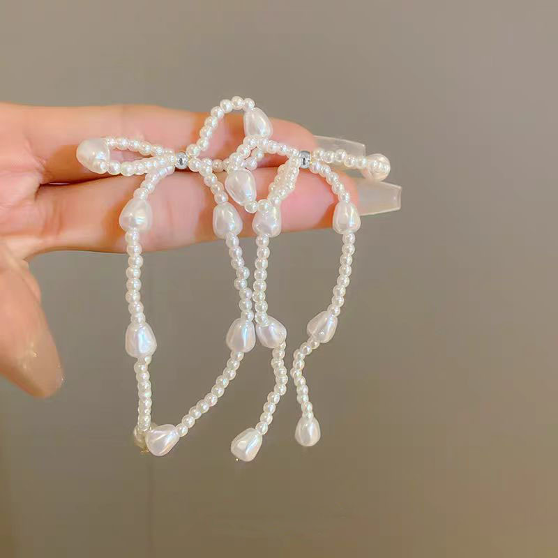 Pearl bow stud earrings, a new bestseller in 2025, are long tassel earrings with a light luxury, niche and high-end design Specification drawing