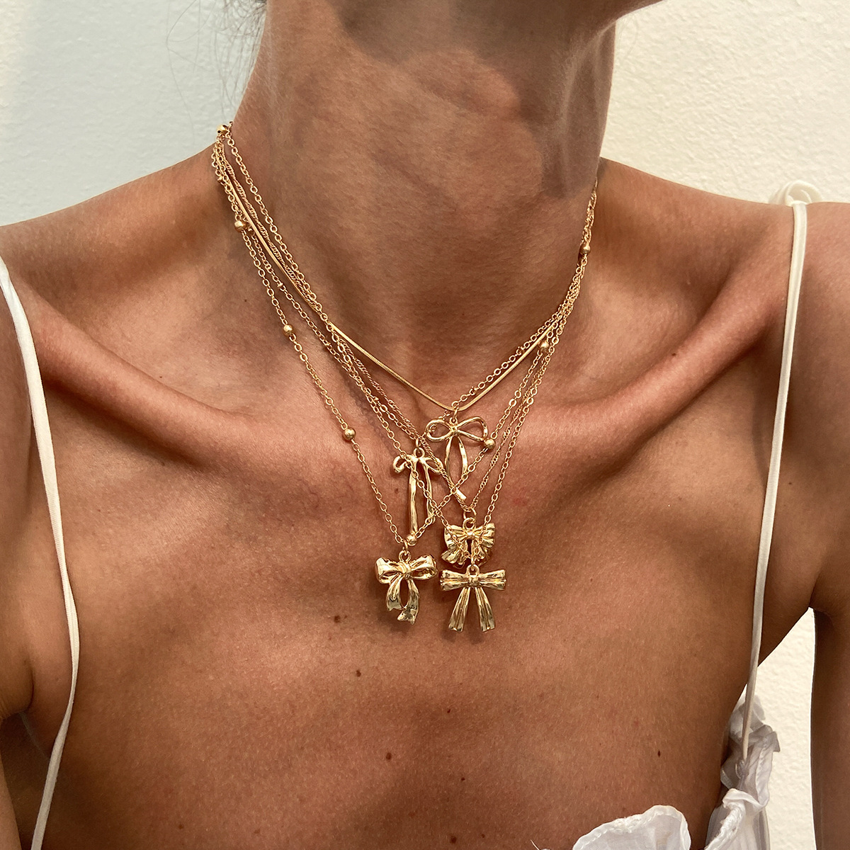 European and American cross-border accessories hip-hop style bow alloy pendant collarbone chain personality simple Necklace set full figure