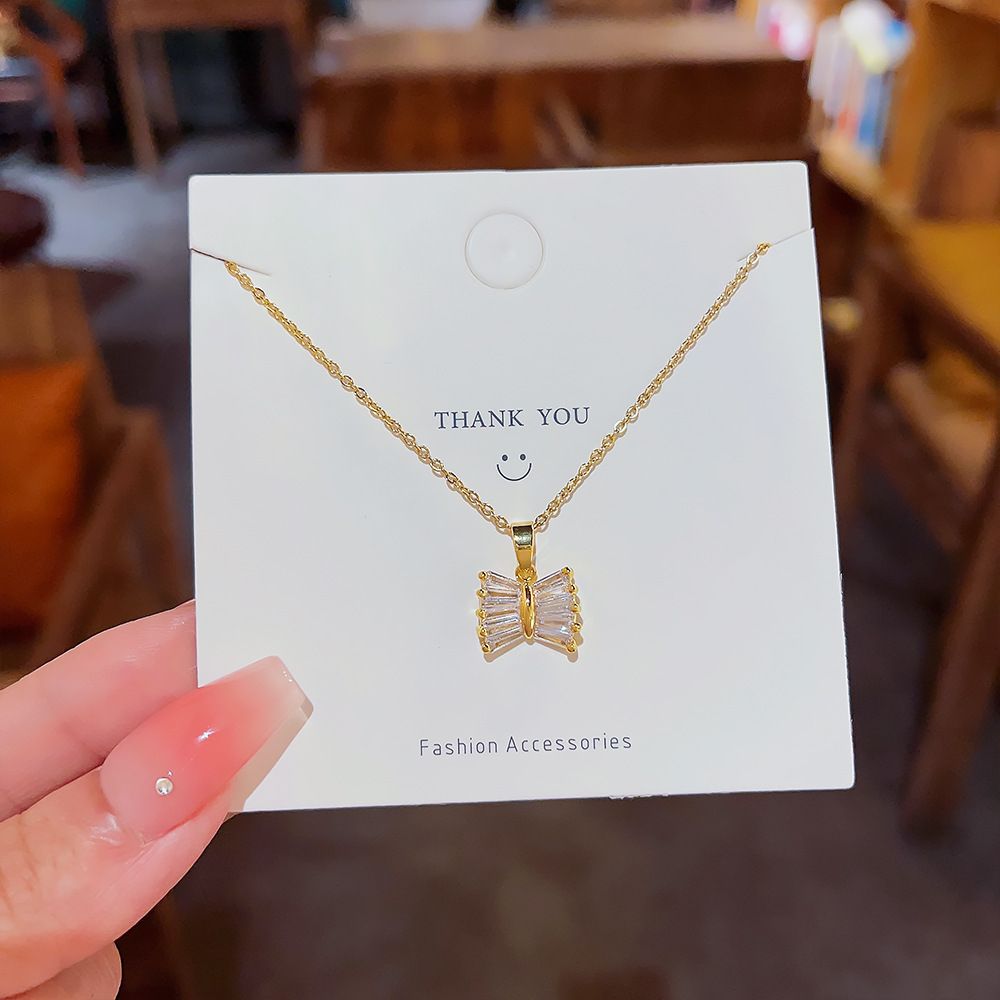 Niche design necklace, ins sweet and elegant bow titanium steel necklace, women's high-end feel, super dazzling light luxury collarbone chain full figure