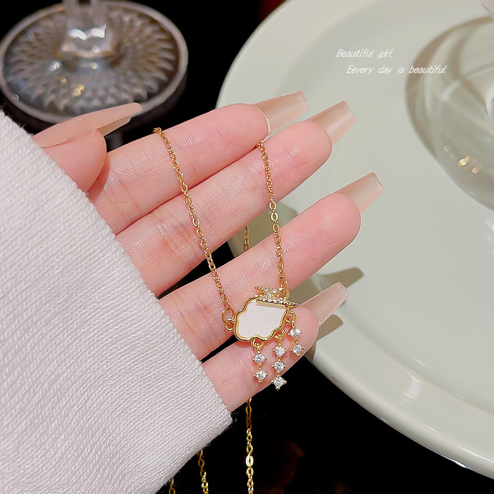 Wholesale of the new Korean internet-famous titanium steel necklace with a versatile design for women, cloud raindrop zircon pendant, collarbone chain and neck chain full figure
