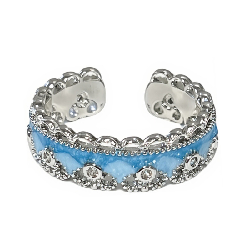 A simple and individual couple ring with a Chinese trend style, featuring a sea blue gradient enamel and a gourd-shaped opening. It has a lace trim Item Picture