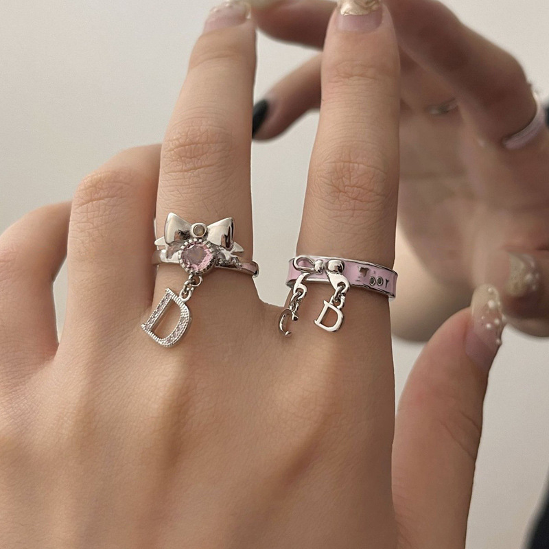 A niche design of a bow with a slightly inlaid zircon letter tassel ring, a high-end pink enamel ring trend for women on Instagram details Picture