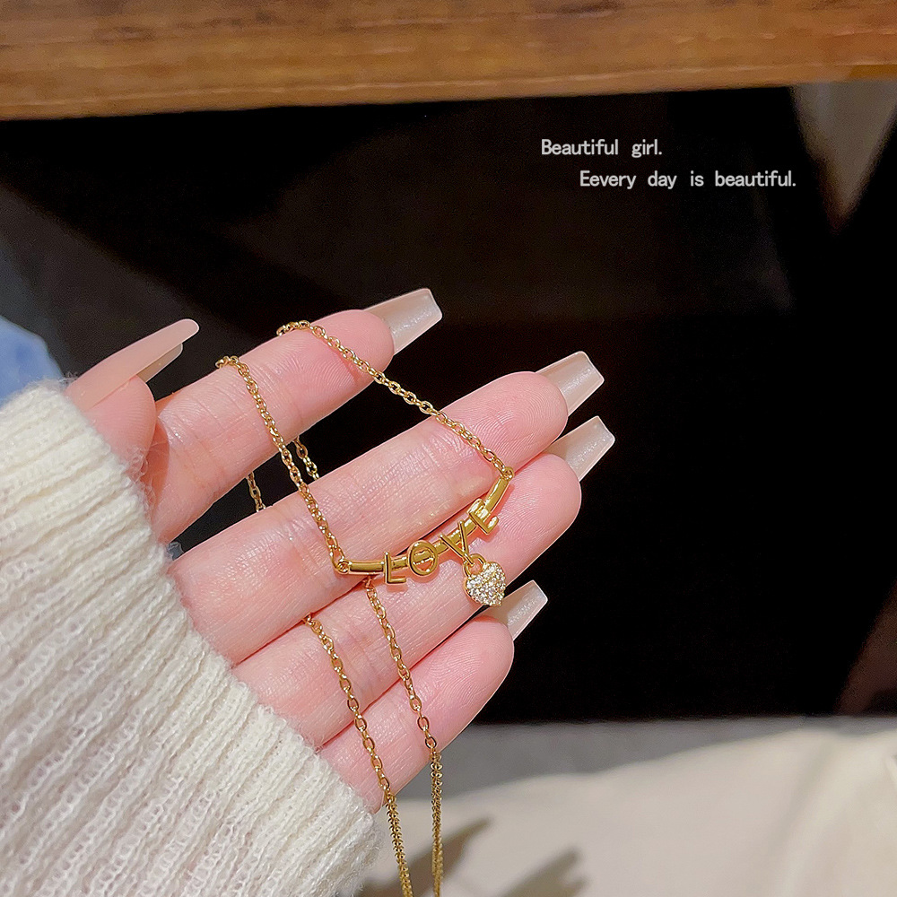 A niche heart-shaped LOVE letter necklace, a fashionable and elegant titanium steel collarbone chain by a female Internet celebrity on Instagram, and a unique cross-border accessory Application Scenario
