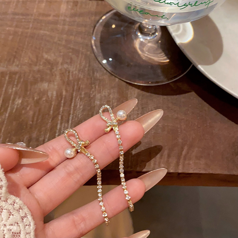 Exquisite micro-inlay bow tassel earrings for women, new design sense, popular pearl stud earrings, best-selling earrings details Picture
