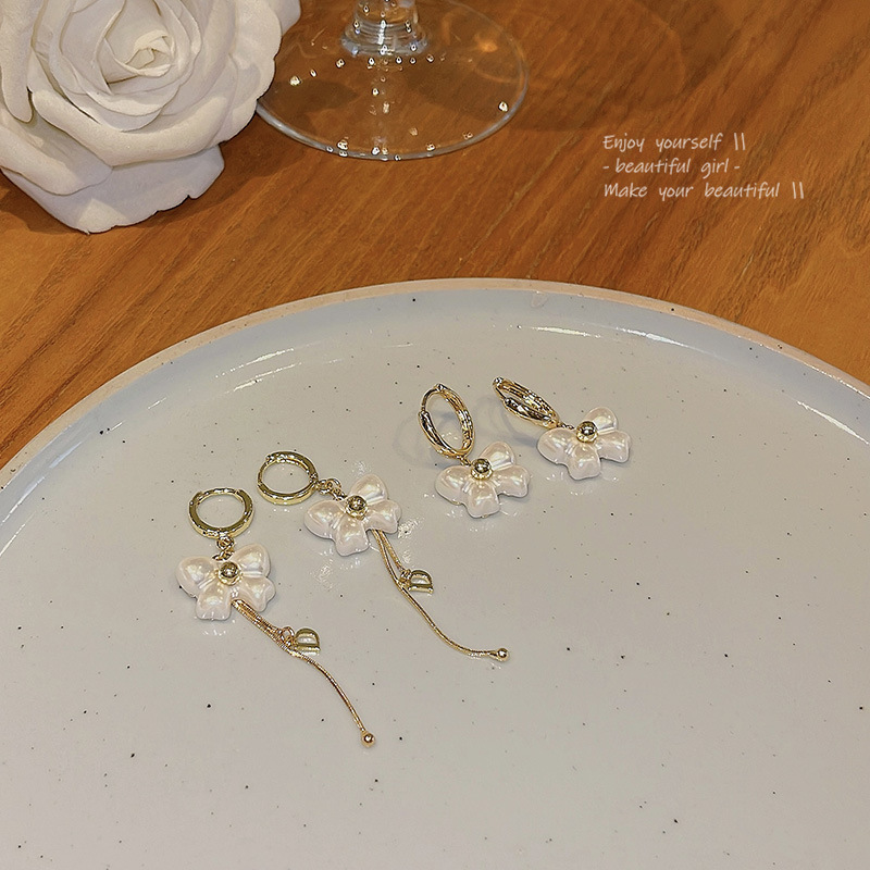 S925 Silver Needle, super ethereal, white bow stud earrings, women's high-end design, long tassel earrings wholesale Application Scenario