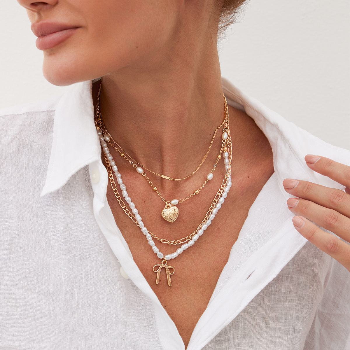 European and American cross-border jewelry, fashionable multi-layer bow heart-shaped pendant, metal necklace, niche pearl beaded necklace Specification drawing
