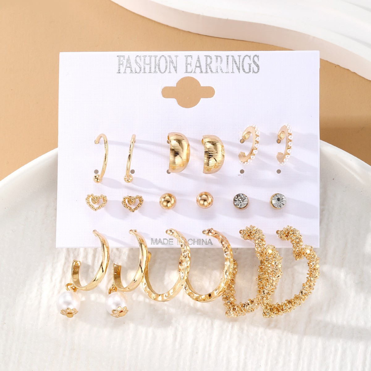 European and American cross-border best-selling retro exaggerated women 's heart-shaped stud twisted pearl earrings 9-piece set earrings Application Scenario