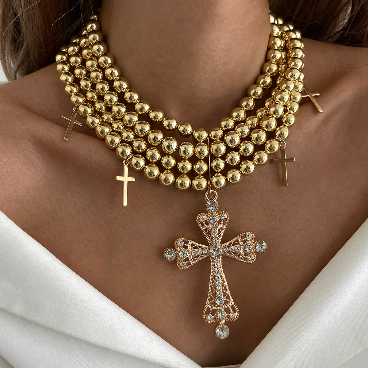 A multi-layered diamond cross necklace with a European and American light luxury style, featuring an exaggerated and unique charm. CCB round bead necklace full figure