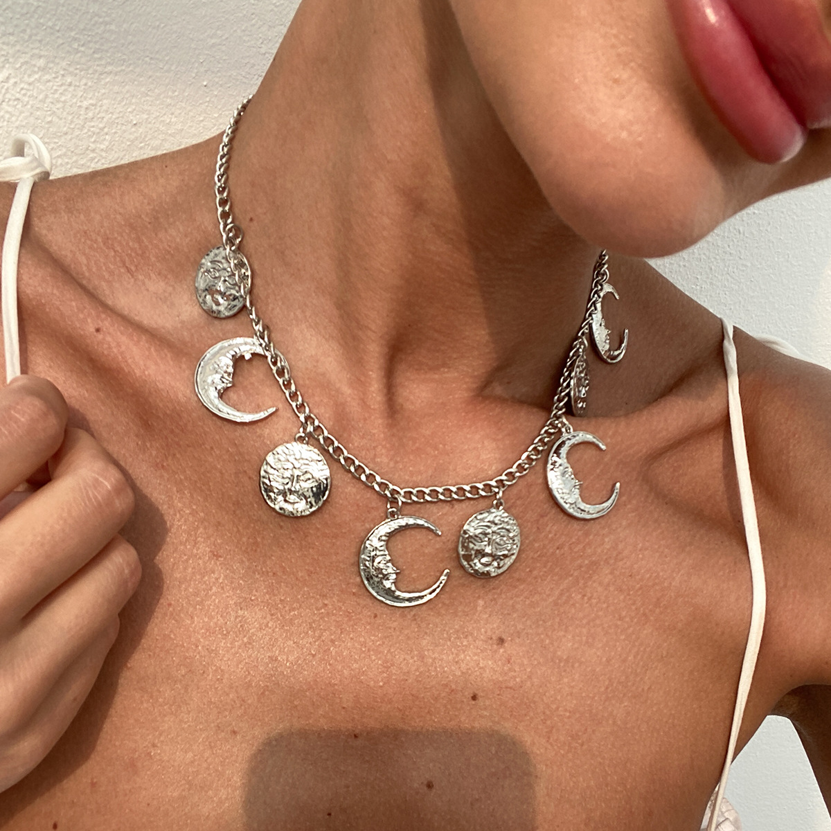 European and American cross-border jewelry, exaggerated geometric cold style personalized necklaces, star and moon tassels, human figure pendants, metal necklaces details Picture