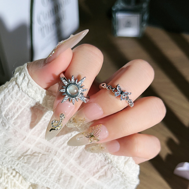 A simple and cold style star-shaped egg face open ring for women with blue diamonds and butterflies, exquisite, light luxury, niche and fashionable ring full figure