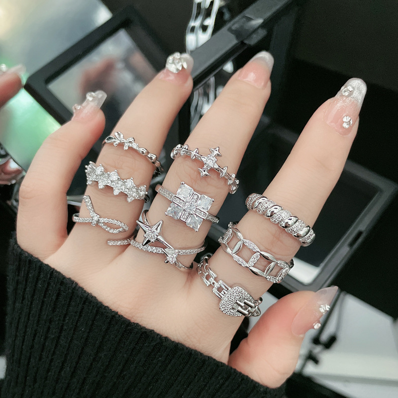 A high-end, irregular bow, cross and starburst ring for women, with a light and luxurious touch, is exquisite and adjustable full figure