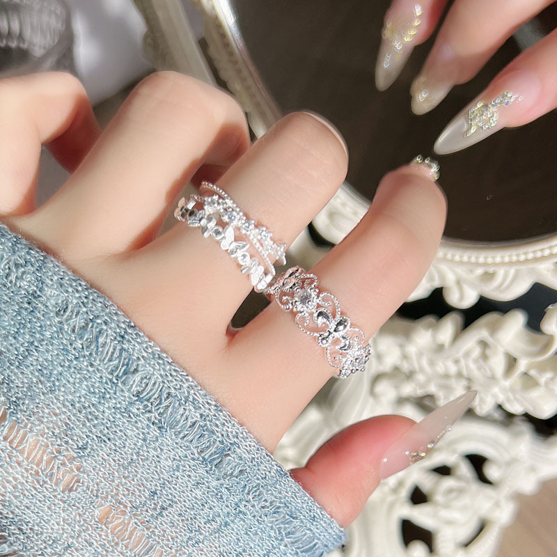 The new summer silver-white butterfly double-layer geometric hollowed-out ring with iris flower for women, featuring a unique, elegant and high-end style, is a trendy ring details Picture