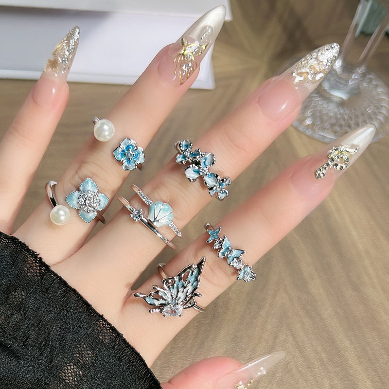 A niche, cool, sea blue gradient butterfly flower open ring for women with pearl fashion layering, a light luxury ring details Picture