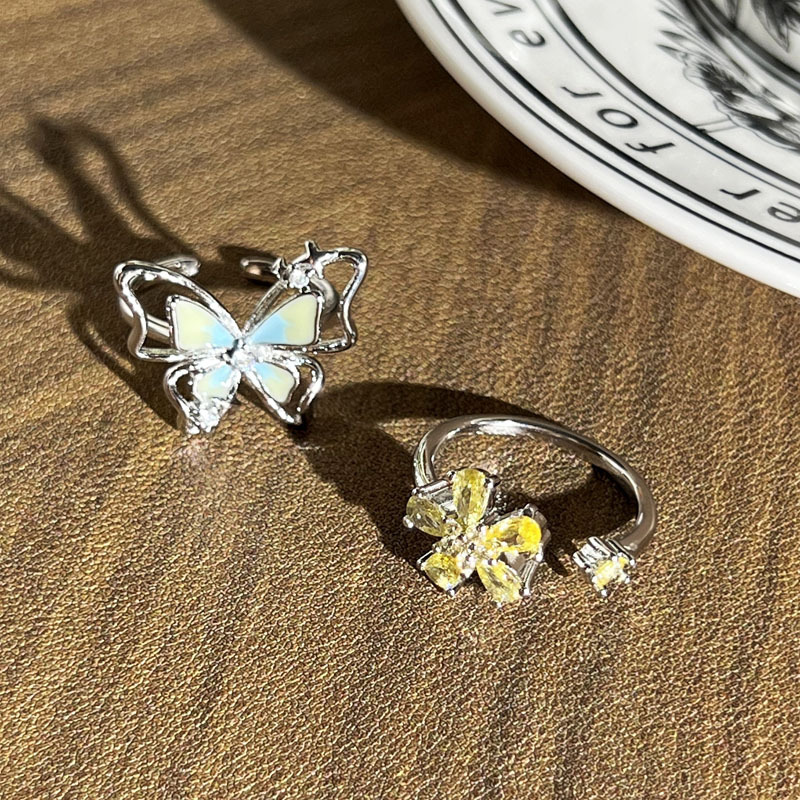 High-appearation-level three-dimensional hollowed-out butterfly dopamine enamel ring, sweet yellow diamond flower light luxury exquisite index finger ring for women Application Scenario